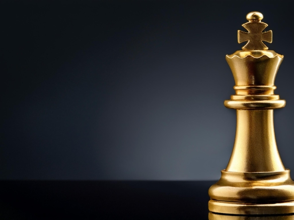 Golden chess king piece