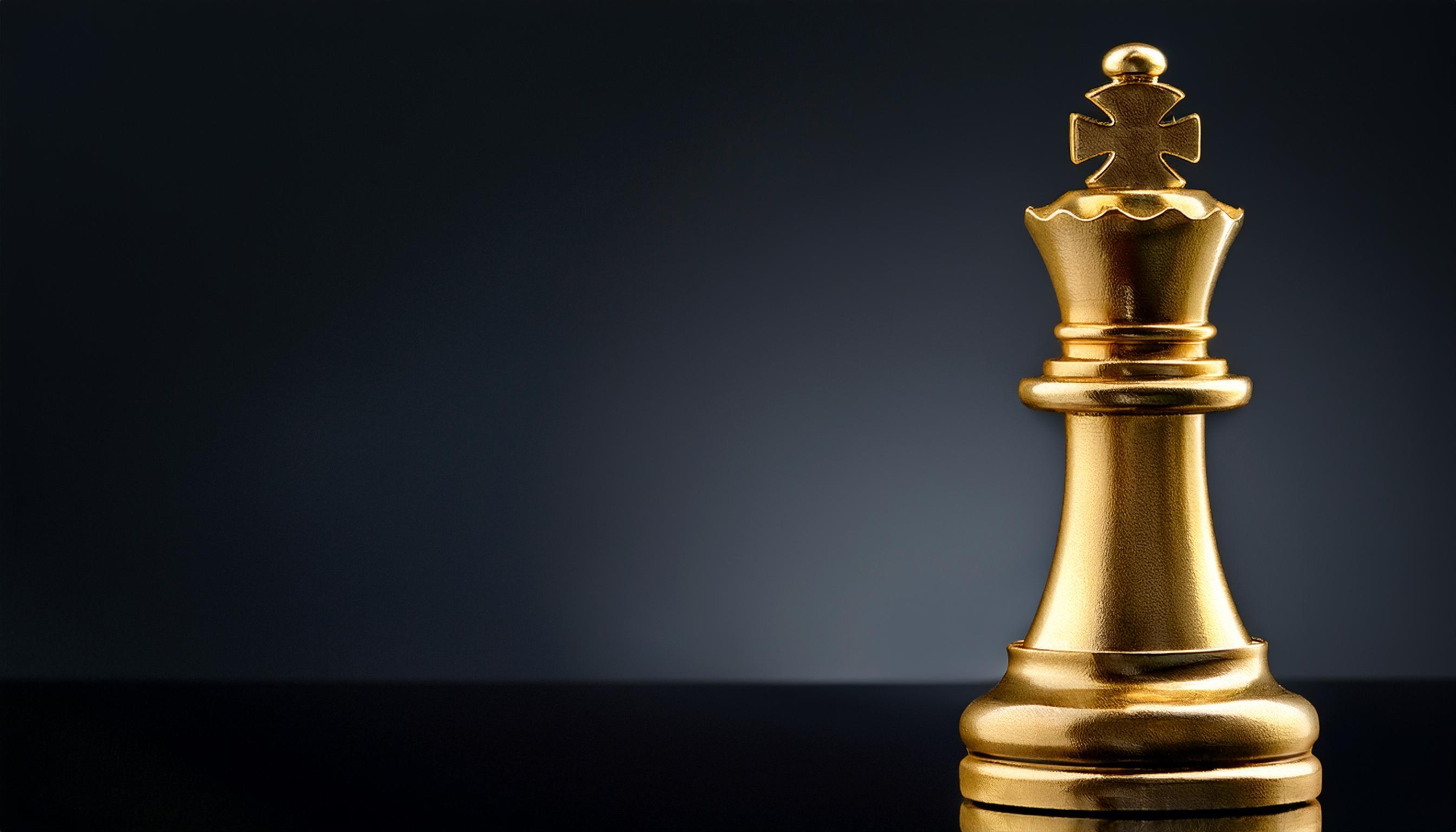 Golden chess king piece